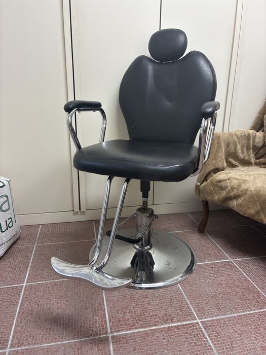 Cadeira de barbeiro usada