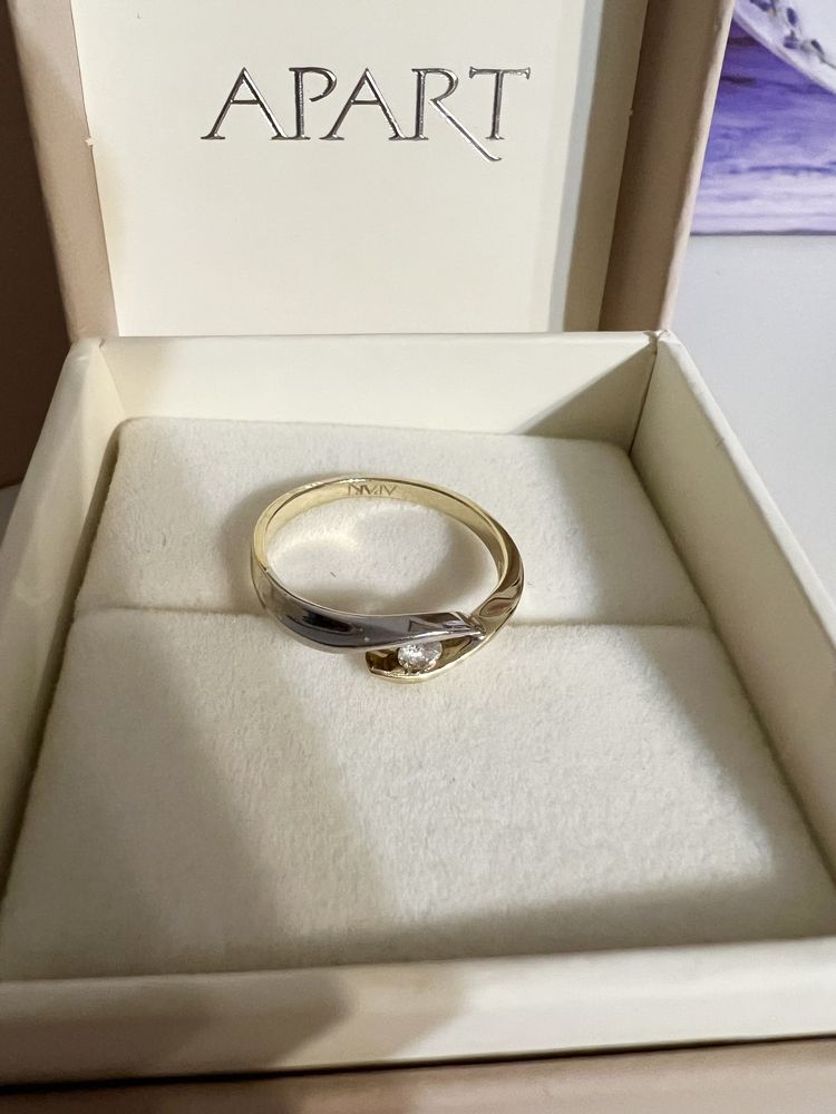 Pierścionek Apart diament 0,07 ct. białe i żółte złoto 585 rozm. 11.
