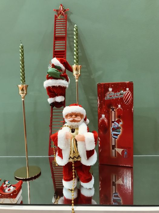 Іграшка дереться по ланцюжку дід Моороз