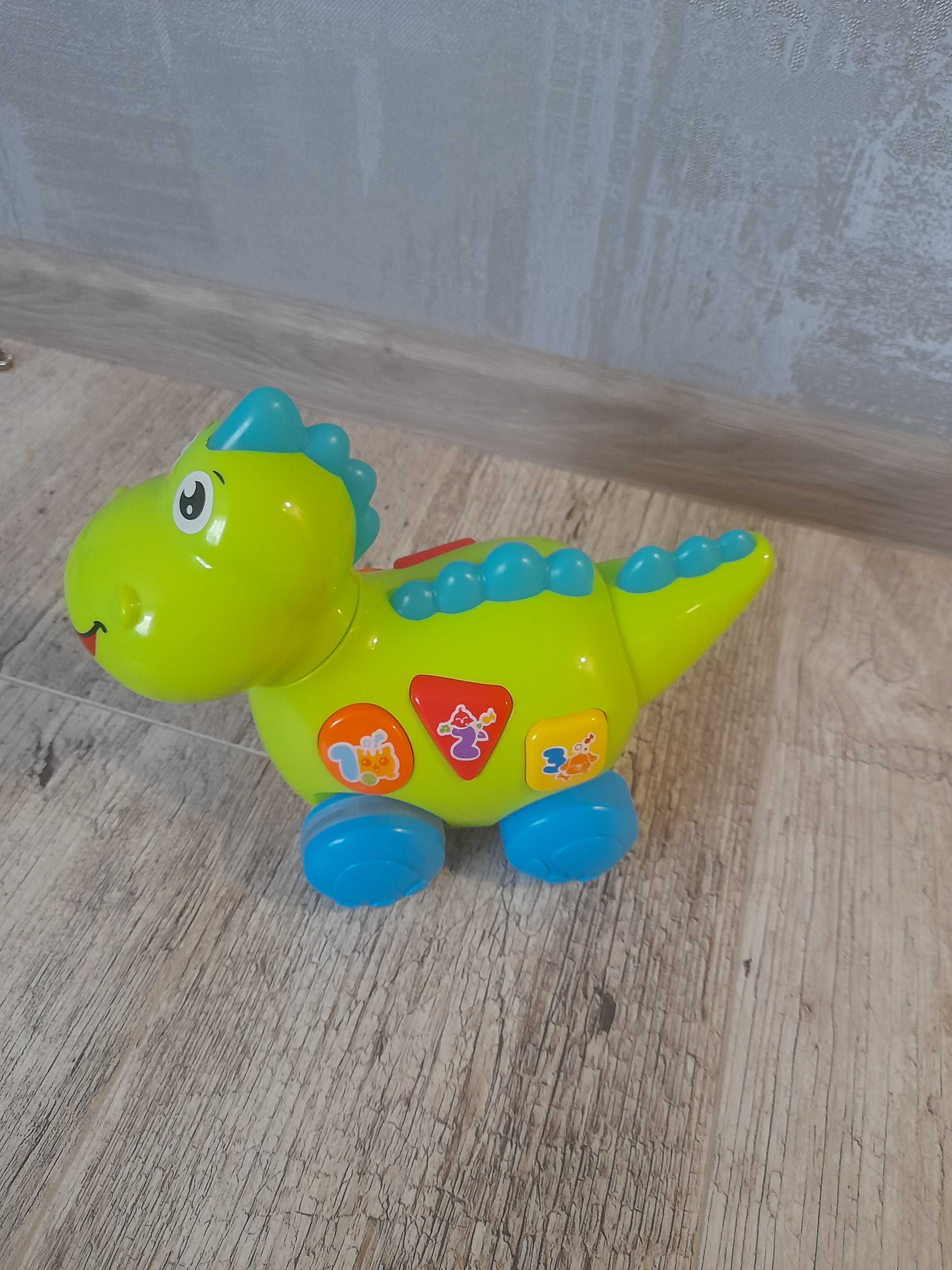 Розвиваюча інтерактивна іграшка динозавр для малюків від Hola