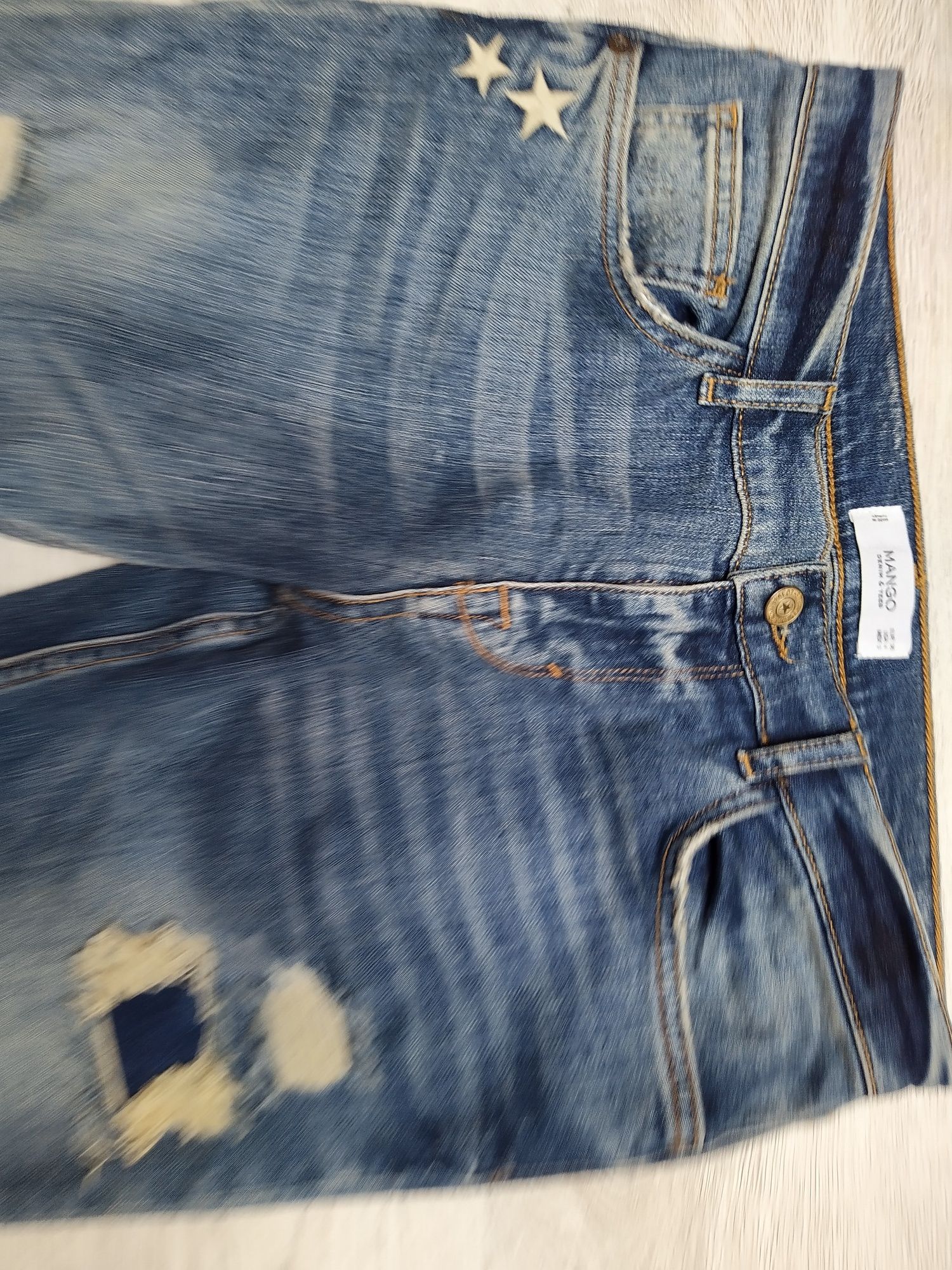 Świetne spodnie jeansowe Mango z dziurami, S / M