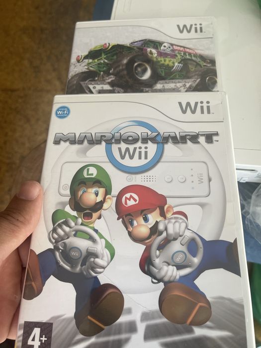 Nitendo wii com acessorios e 2 jogos