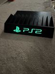Stojak podstawka na gry PlayStation 2 napis fluorescencyjny