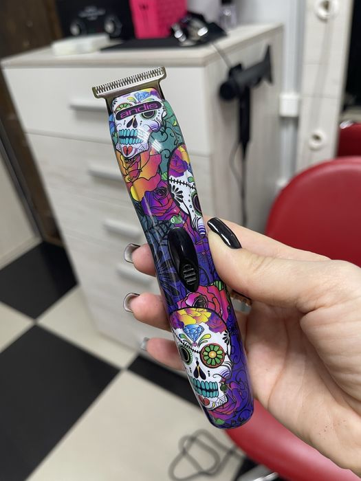 Тример andis та пістолет для проколу вух