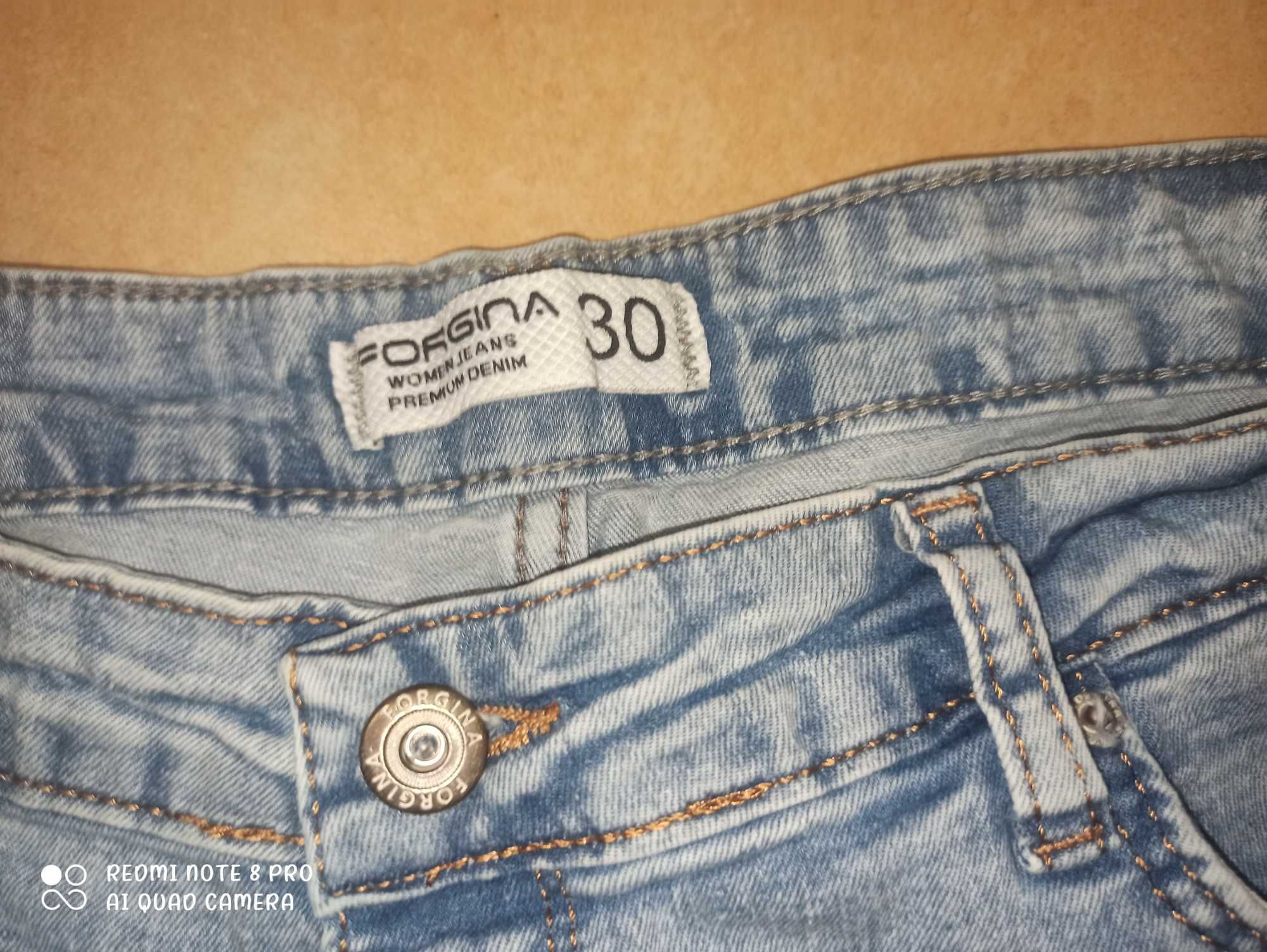 jeansy jasne damskie  z dziurami r.30