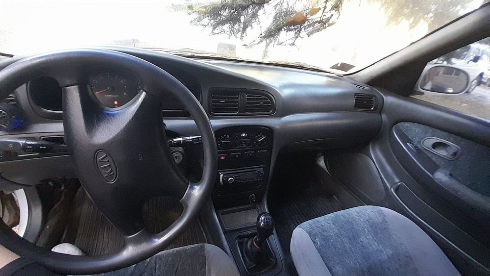 Кіа Кларус 2000 рік 2.0 газ/бензин ціна за двигун частинами