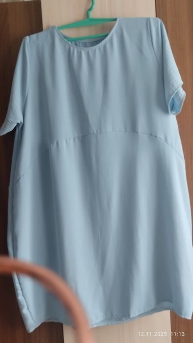 Sukienka bombka tuszując krągłości