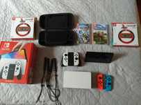 Nintendo Switch OLED + kierownice + gry + etui +2x joycon