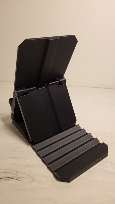 Підставка для телефона з регулюванням положення