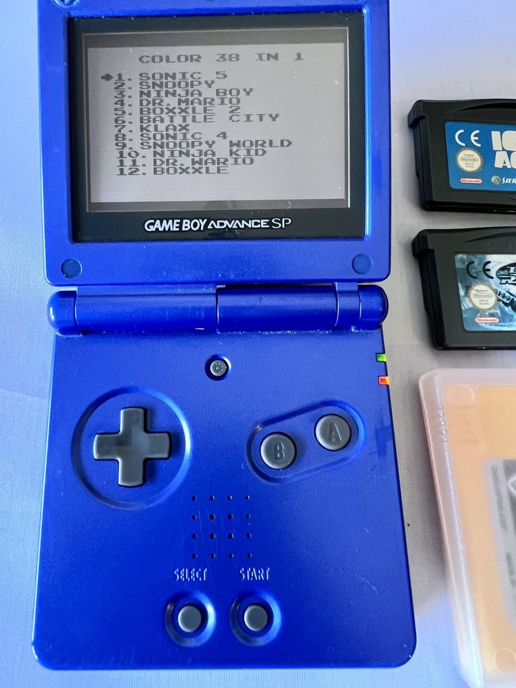 Gameboy advance sp azul com carregador e 4 jogos