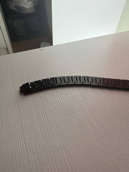 pulseira preta lacoste