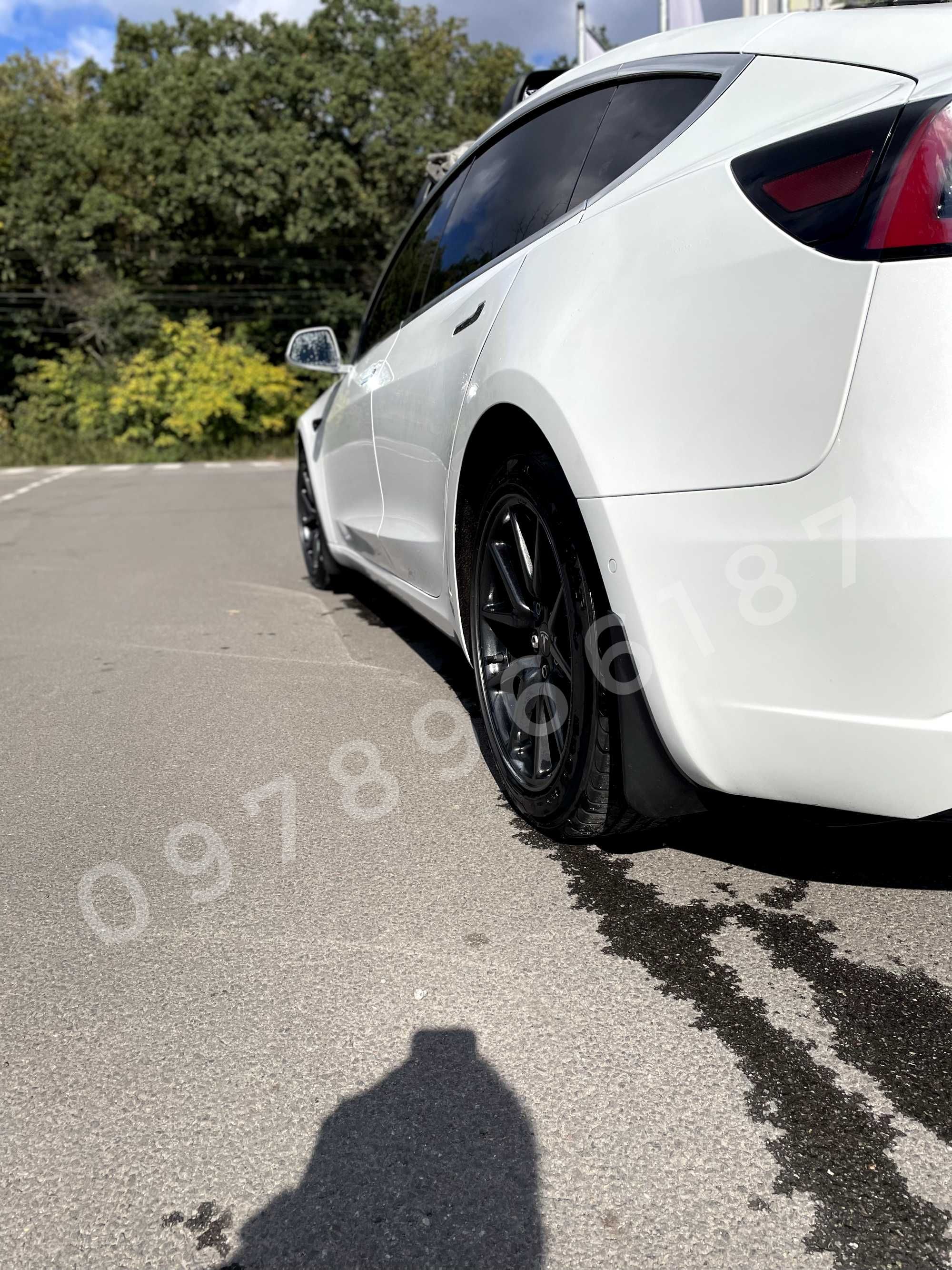 Tesla Model 3 2016 - 2023 бризговики оригінал підкрилки болотніки