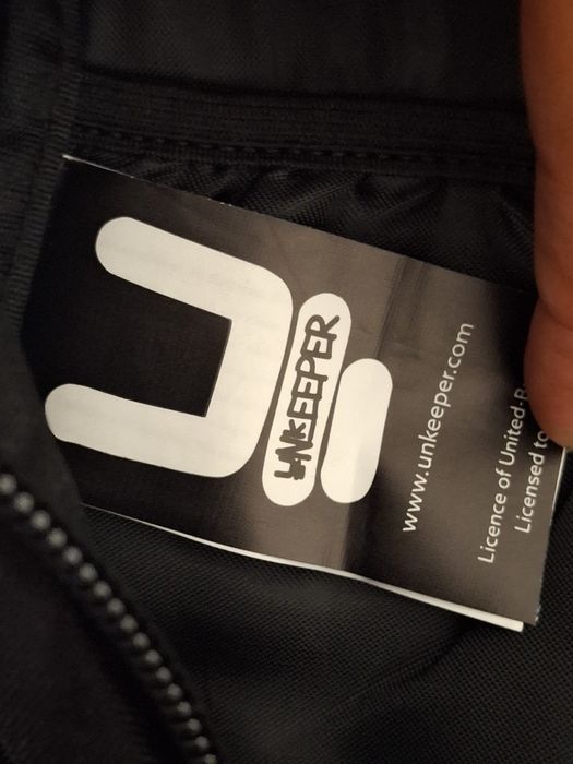 Mochila Unkeeper tons cinza e preto nova rapaz