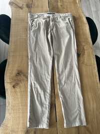 Męskie spodnie guess kremowe rozmiar 36