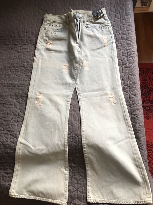 Jeansy dzwony z przetarciami W 33 L 32