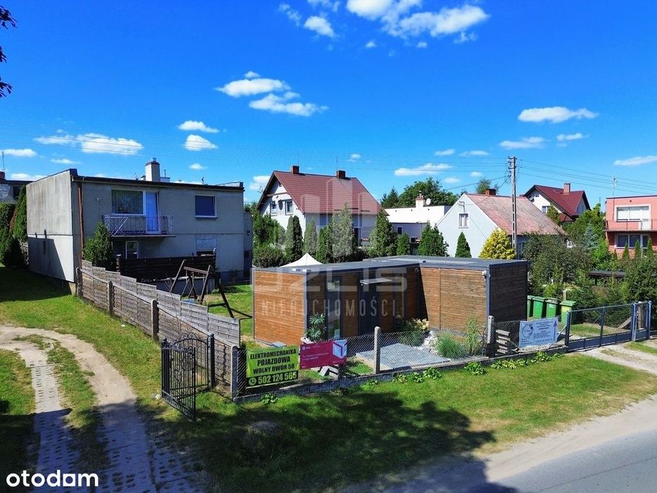 Funkcjonalny dom z dodatkową zabudową