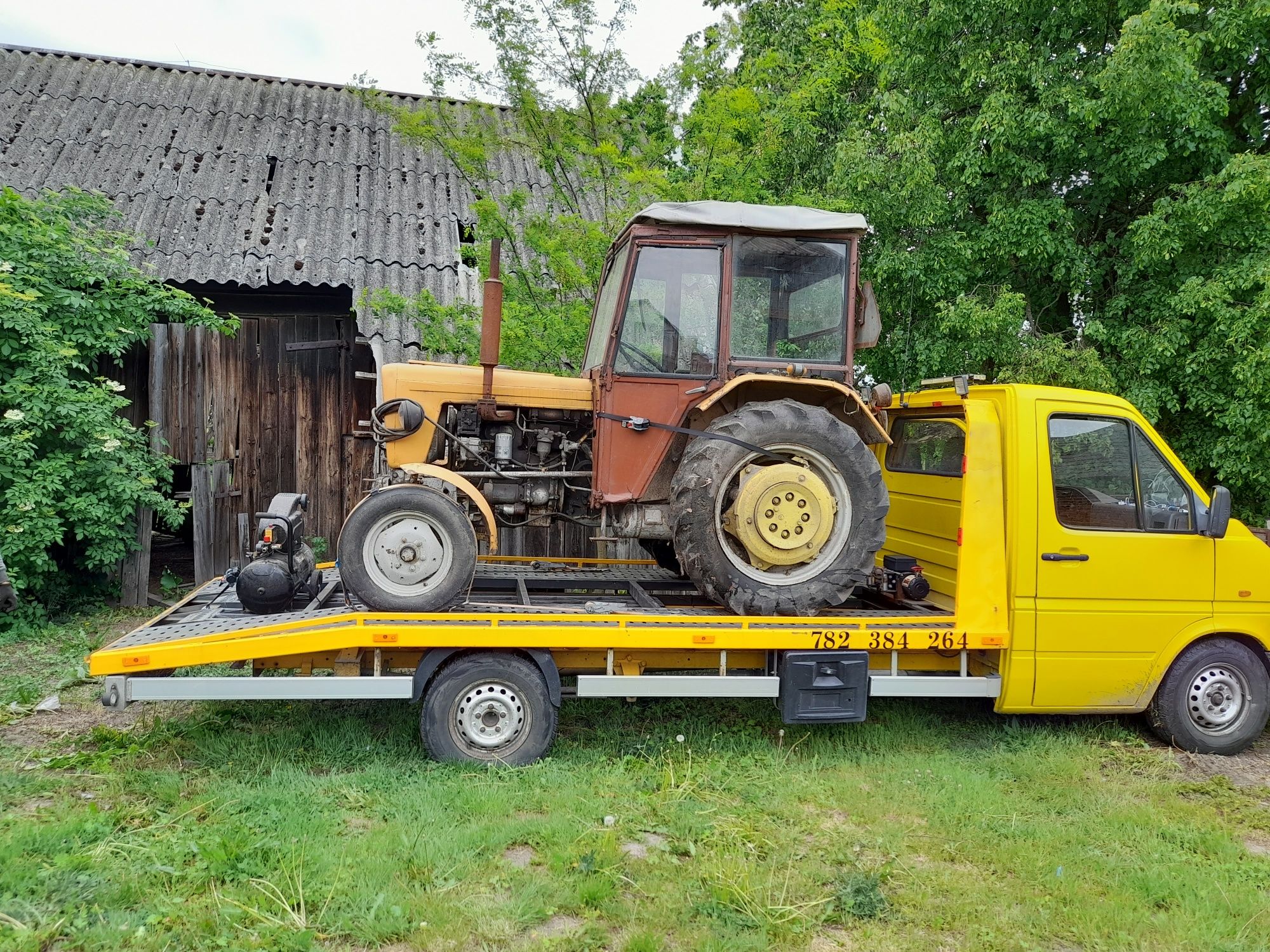 Pomoc drogowa transport przewóz samochodu traktora koparki  autolawet
