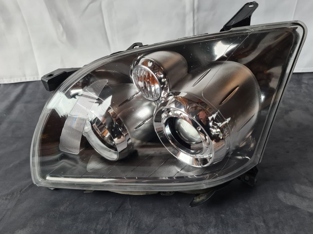 Lampa Przednia Lewa Toyota Avensis  T25 Lift soczewka