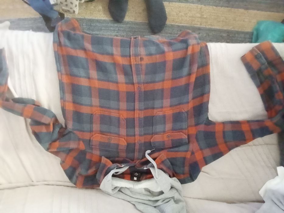 Camisa DC laranja e azul
