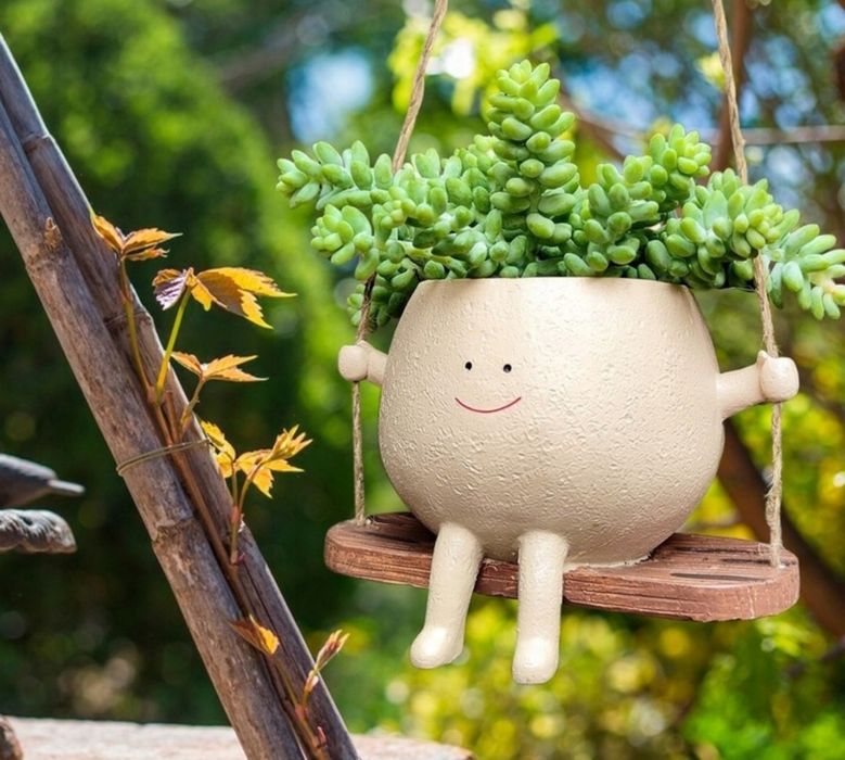 Wisząca doniczka na huśtawce na kwiatki