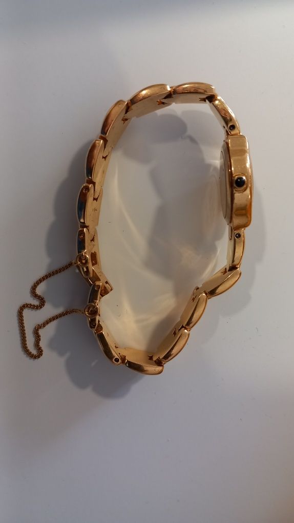 Relogio Oriente dourado