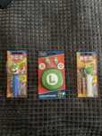 Super mario sluchawki i cukierki PEZ Luigi i Yoshi