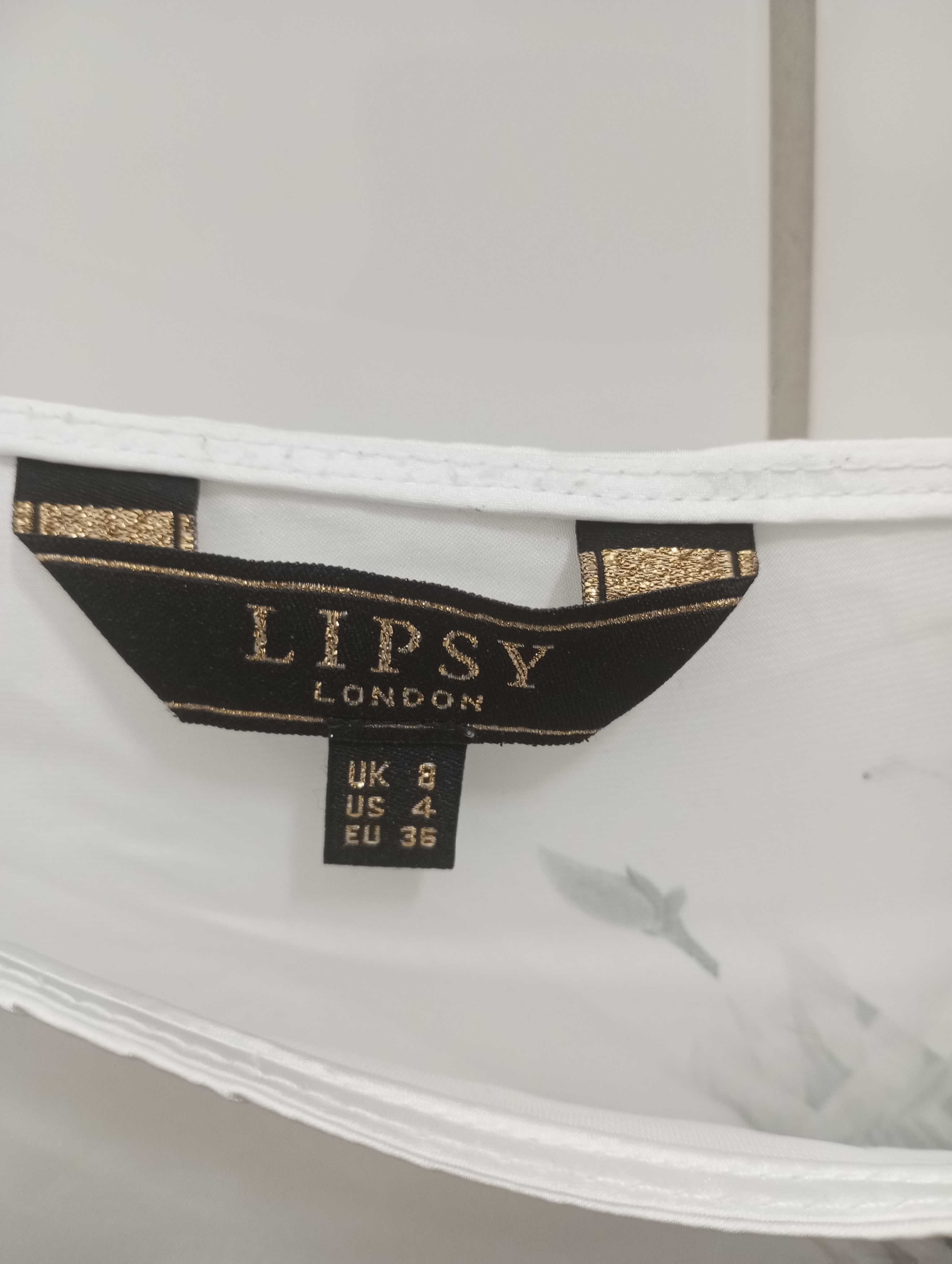ŚLiczna i ciekawa bluzka, asymetryczna, biało czarna , kwiaty. Lipsy.