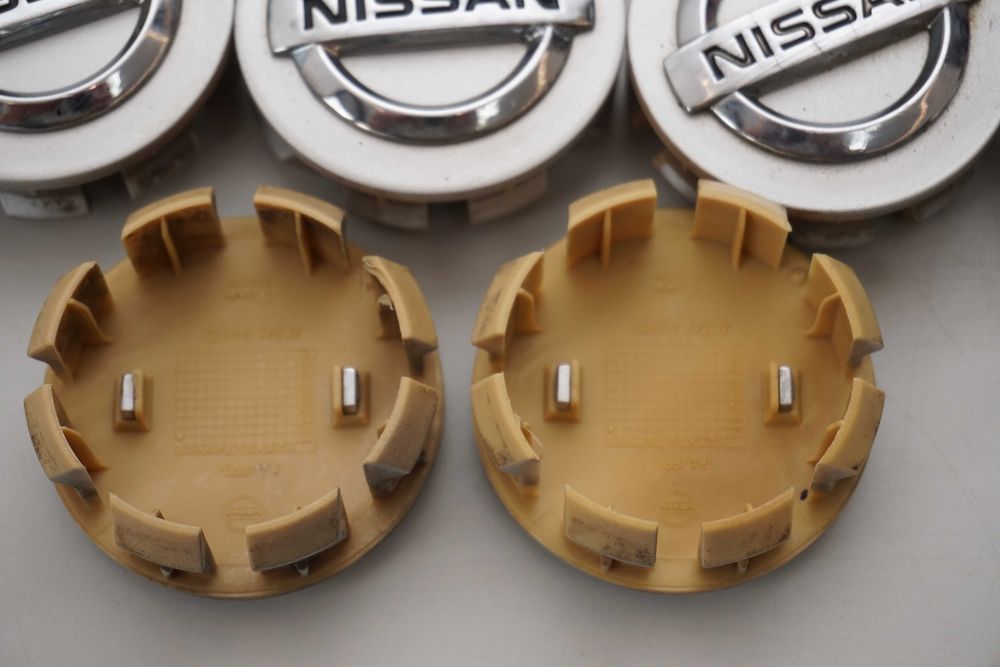 Dekielki oryginał Nissan OE 54mm 40342 AV610 srebrne 4sztuki