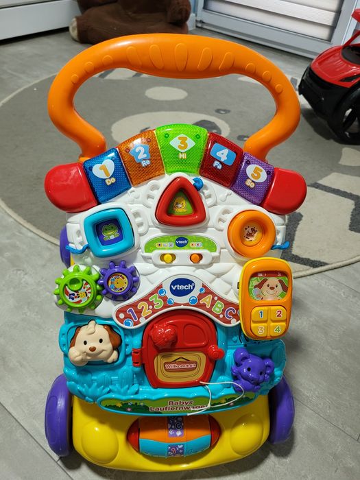 Wózek do nauki chodzenia dla niemowląt Vtech chodzik domek pchacz niem