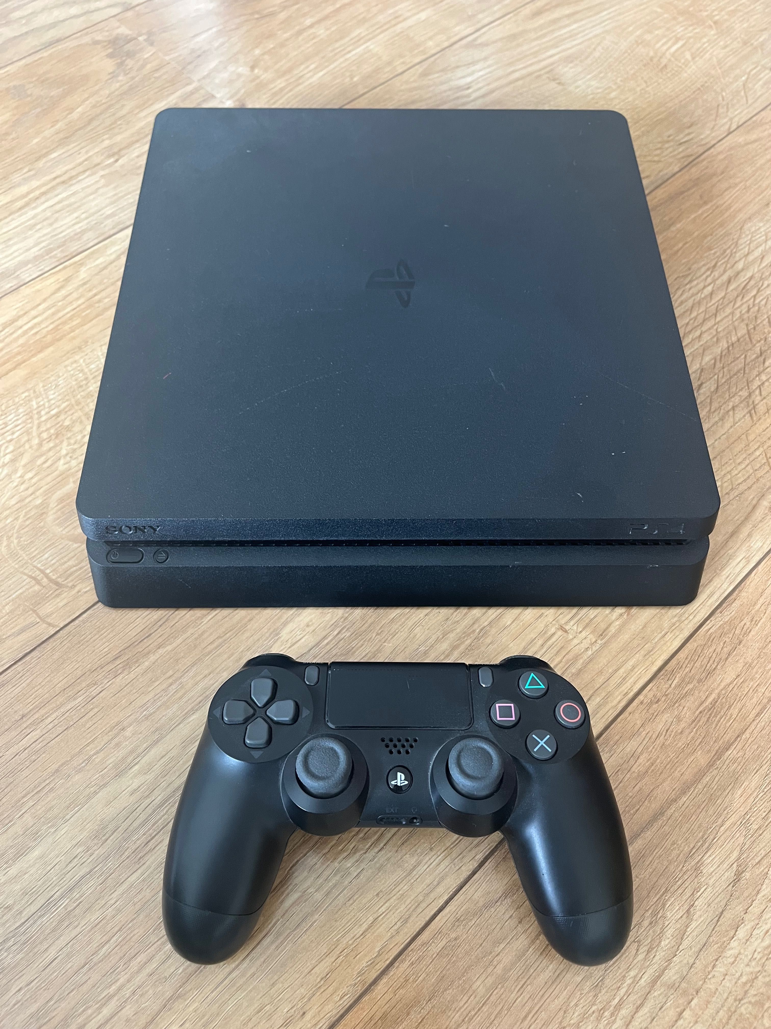 PlayStation 4 Slim 1 TB com comando wireless e 2 jogos