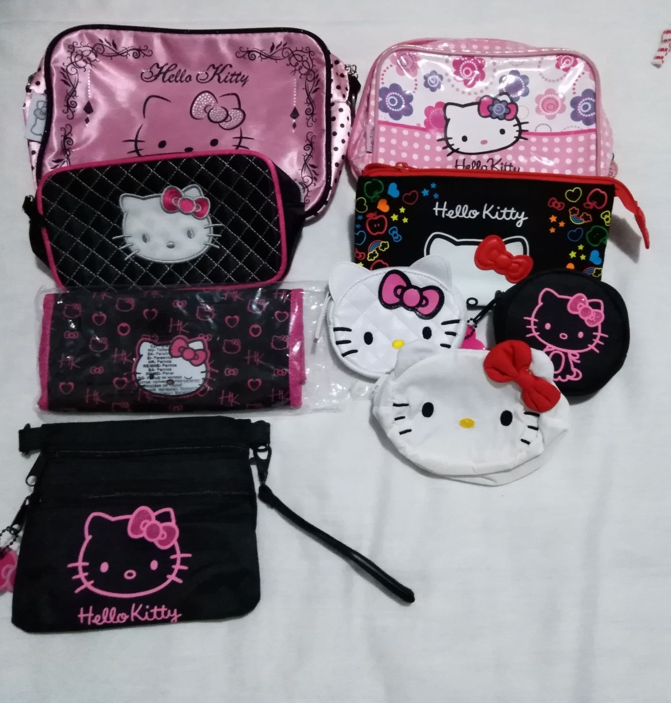 Lote de porta moedas, bolsas, necéssaires, saco e mala da Hello Kitty