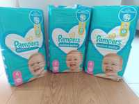 Trzy paczki pampersów 4 active baby od 9 do 14 kg łącznie 174 sztuki s