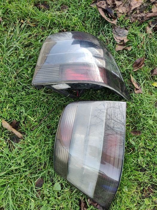 Vw golf IV 4 lampy hella magic colours czarne tylne tylnie prawa lewa