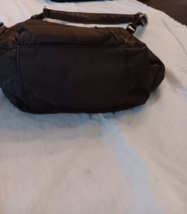 Mala em tecido impermeavel e pele sintetica ,marca parfois .