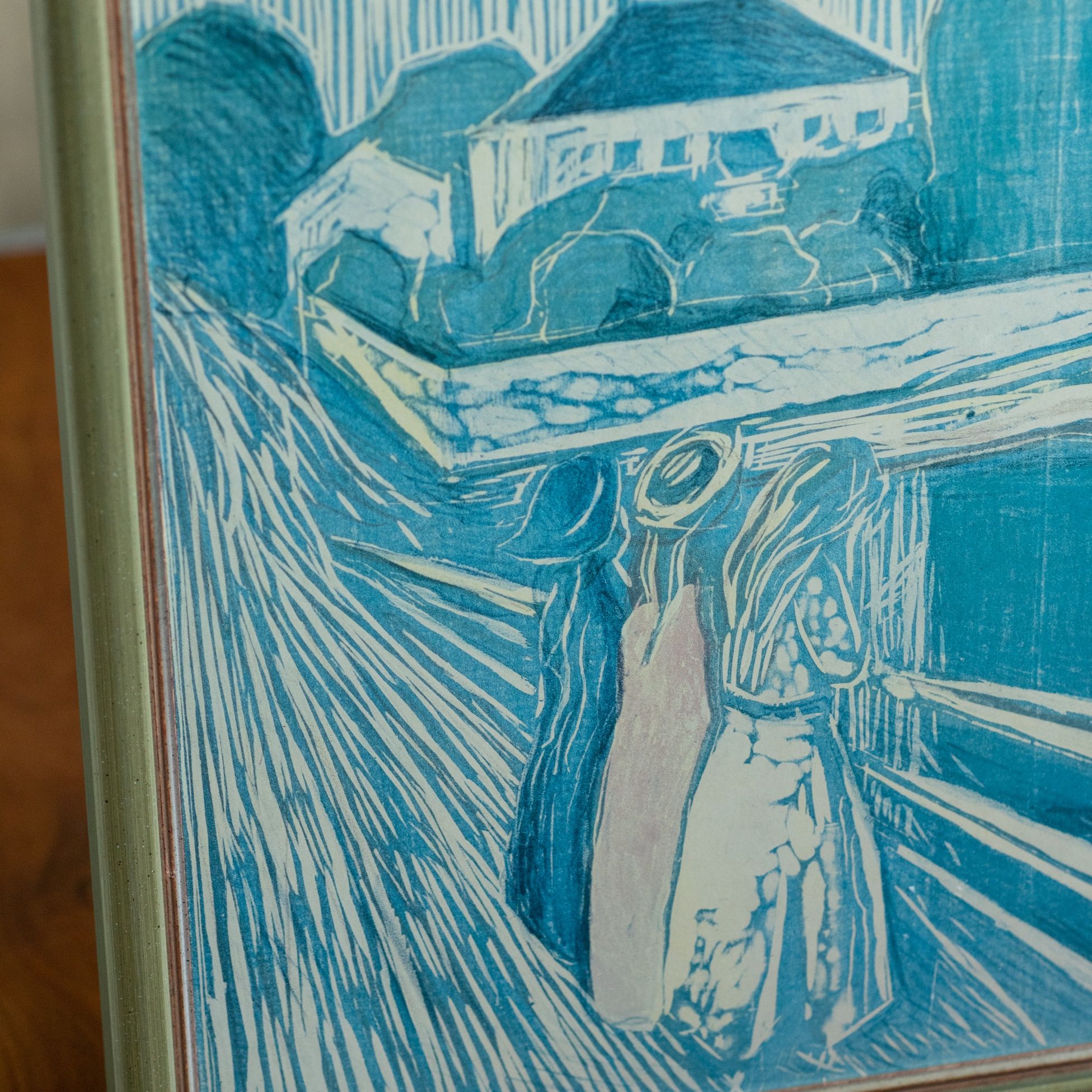 Wydruk Edwarda Muncha na płycie, oprawiony w drewnianą srebrną ramę