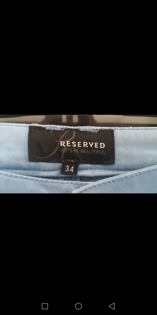Błękitne spodnie damskie Reserved 34