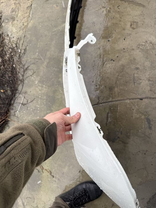 Передний бампер Nissan Rogue T33 дорест левая часть