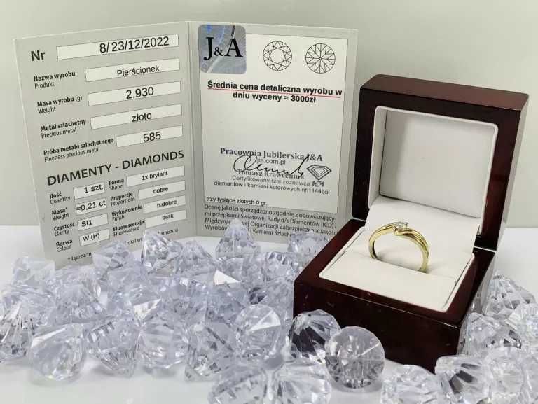 złoty pierścionek 585 z brylantem 0,21CT 20r certyfikat