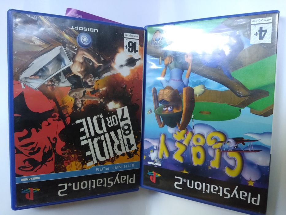 Jogos PlayStation resident evil e guitar hero e NBA e caixas