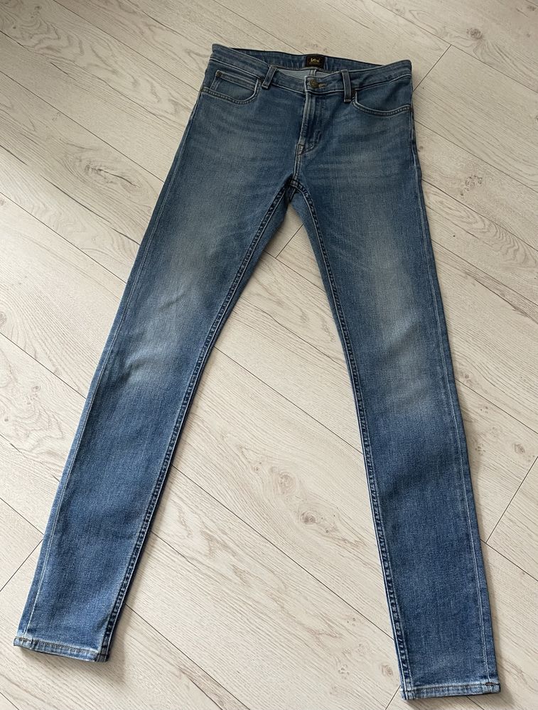 Niebieskie bawełniane meskie spodnie jeansy skinny Lee W30 L34