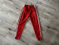 Spodnie Adidas originals UNI pomarańcz