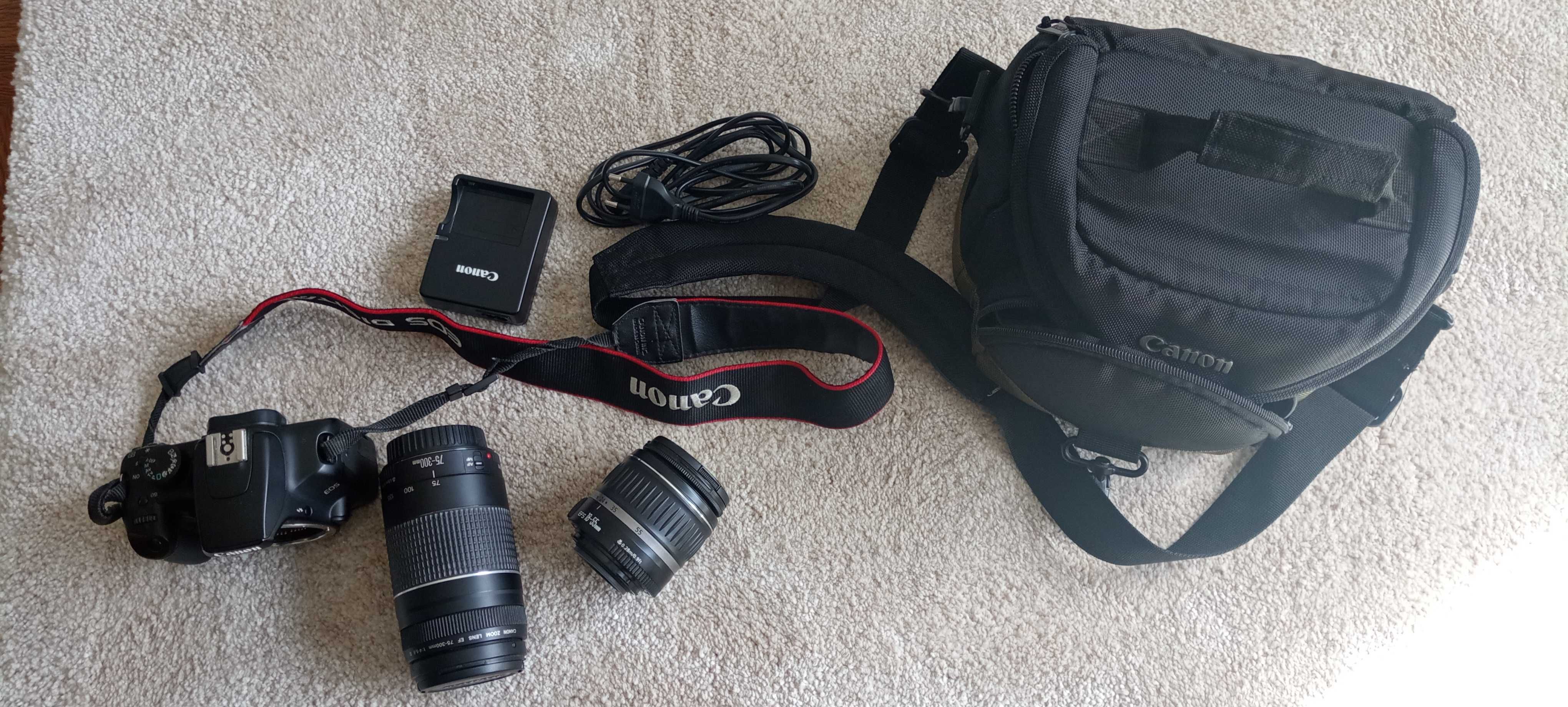 Canon EOS 1000D, com: objetivas 18-55 e 75-300; Carregador e Mala