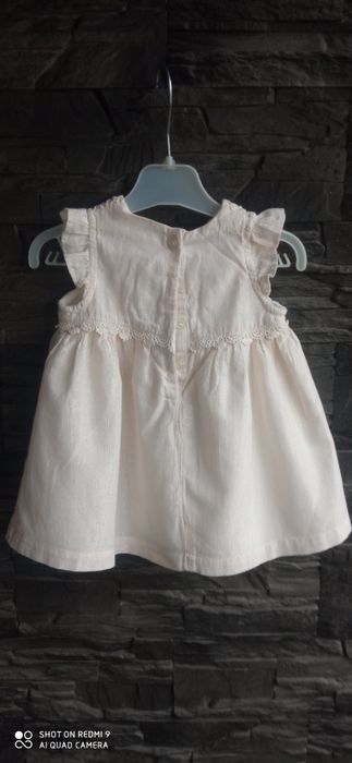 Kremowa świąteczna sukienka Newbie r. 68