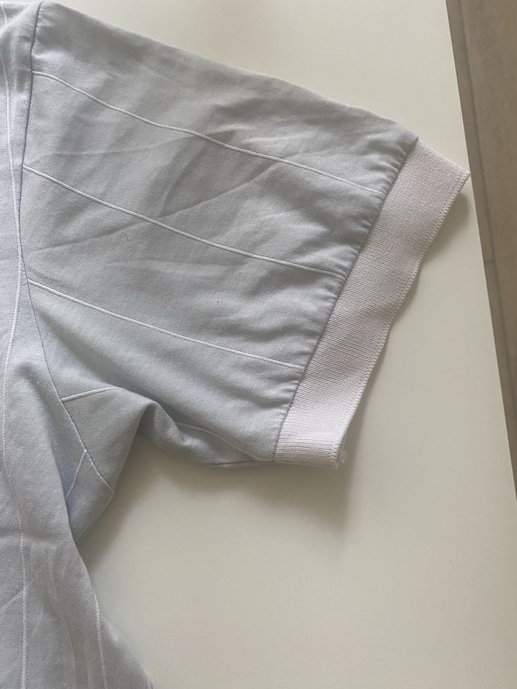 Jasnoszara koszulka Ellesse