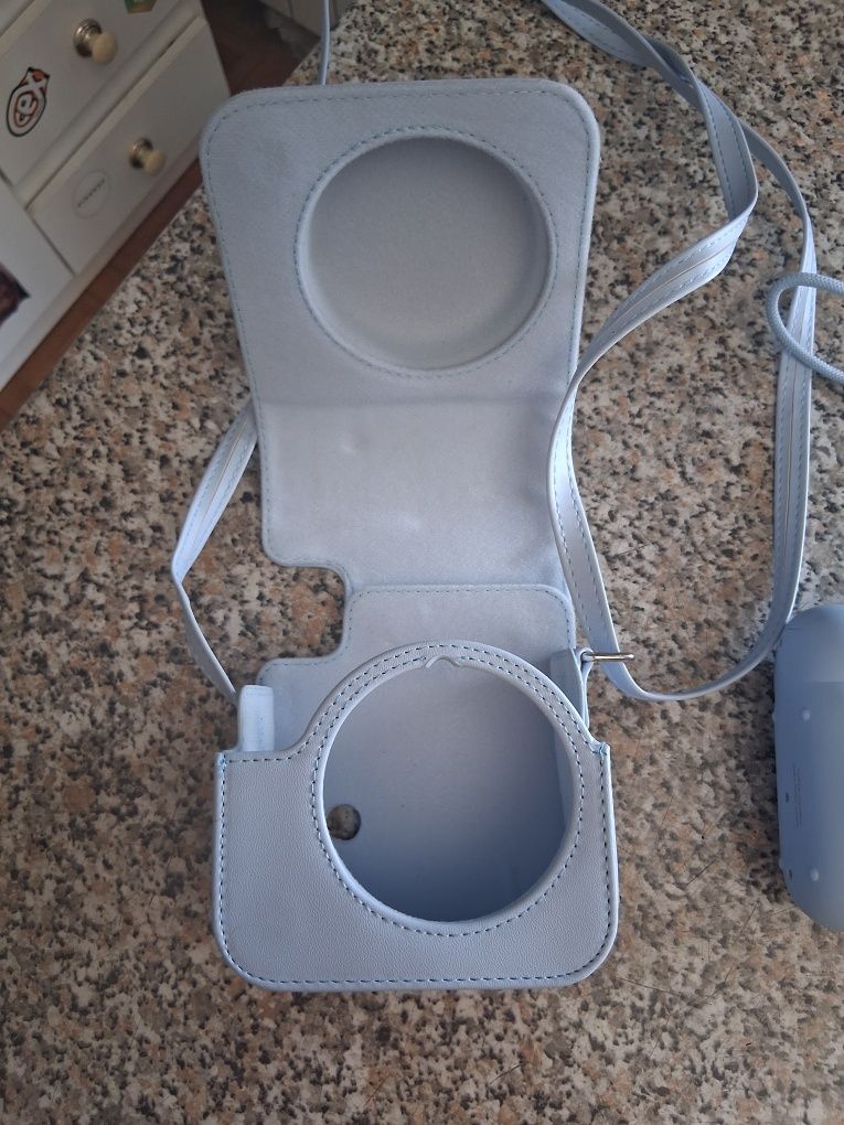 Máquina fotográfica instantânea