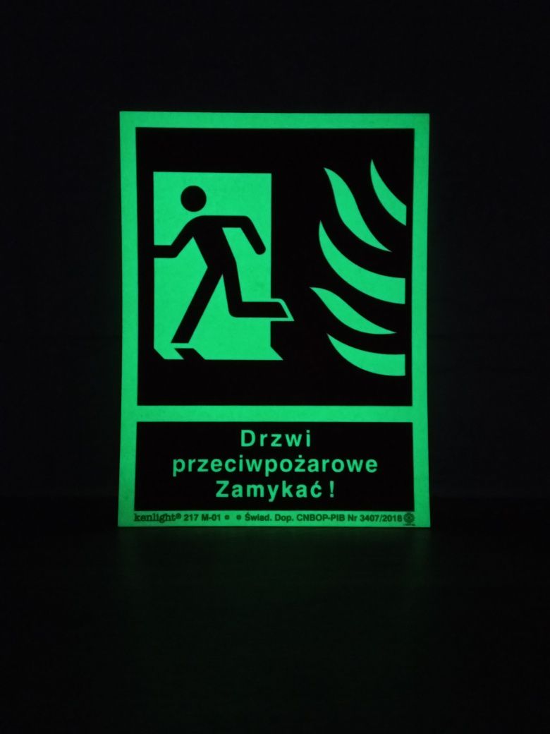 Znak Drzwi przeciwpożarowe. Zamykać! (w lewo)