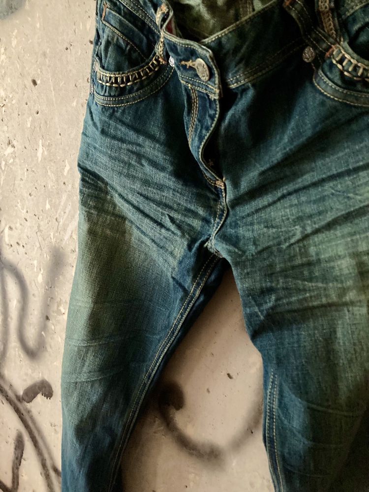 Трендові потерті баггі джинси.