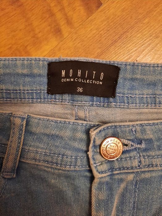 Jeansy z dziurami rozdarciami spodnie jeansowe Mohito rozmiar 36
