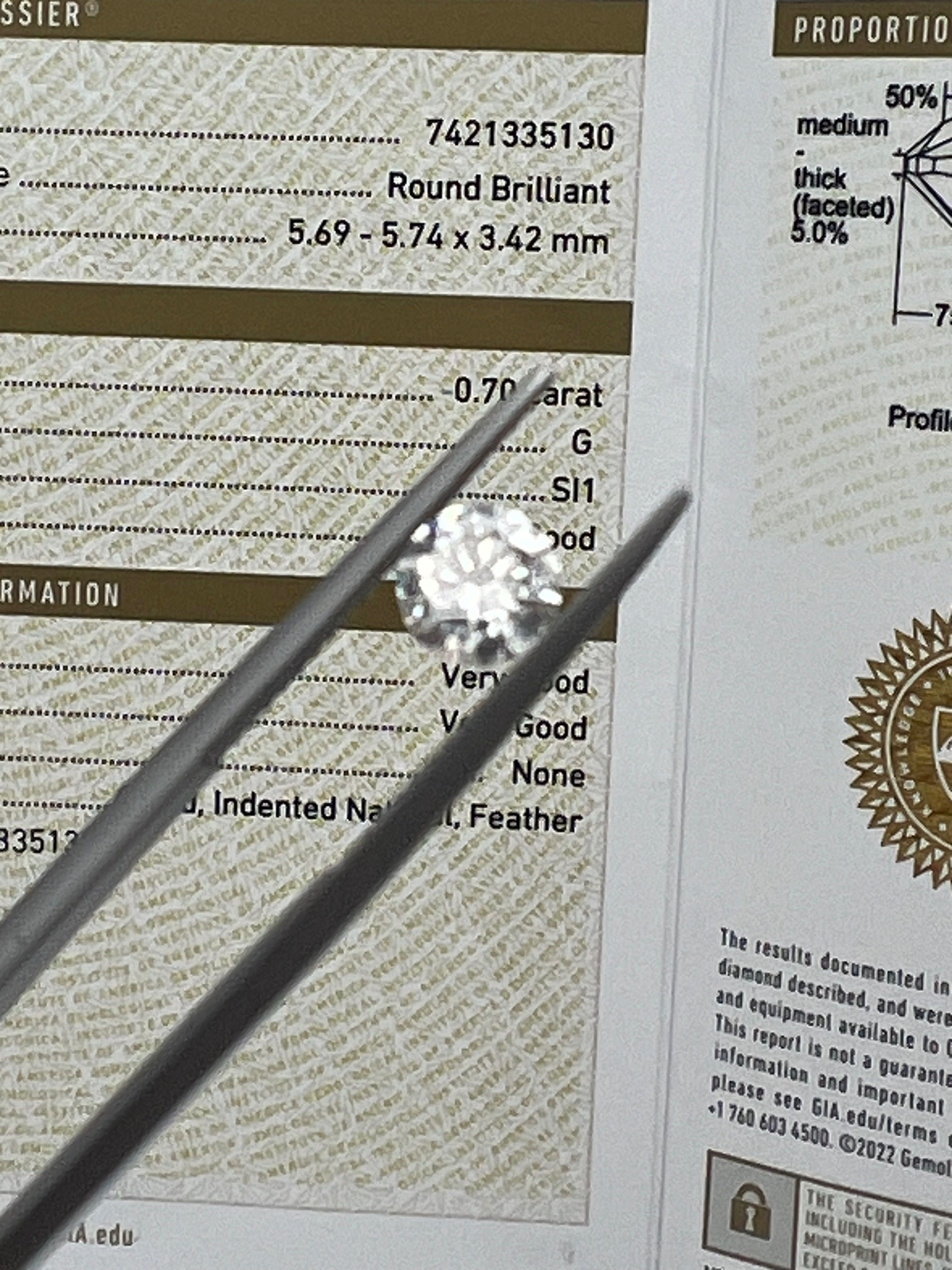 Naturalny brylant 0.7 ct, barwa G, czystość Si1, certyfikat GIA.