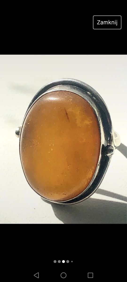 Duży , srebrny pierścionek ze słonecznym bursztynem